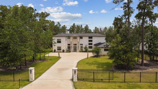 The home is securely enclosed by an electronically automated gate, offering both privacy and convenience with advanced access control. | Image 5