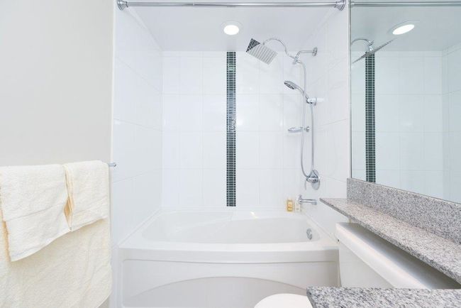 Full bathroom featuring shower combination, toilet, and vanity | Image 15