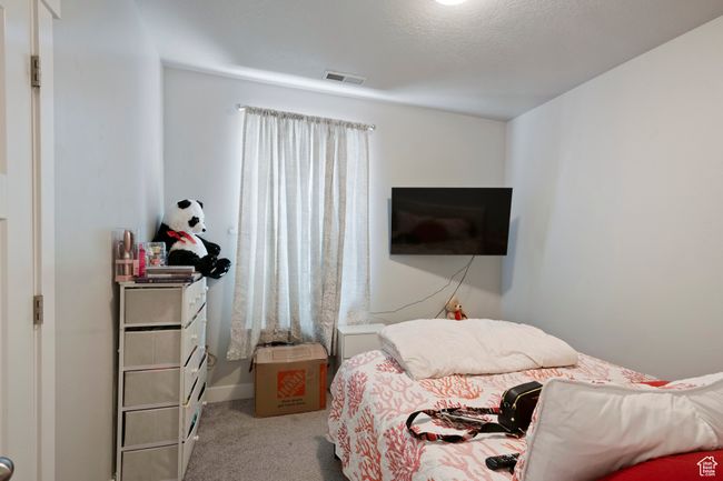 View of carpeted bedroom | Image 12