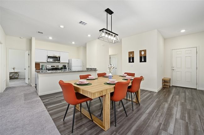 Dining space featuring baseboards, dark wood-style flooring, visible vents, and recessed lighting | Image 8