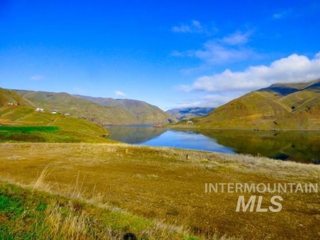 View of mountain background with a nearby body of water | Image 36
