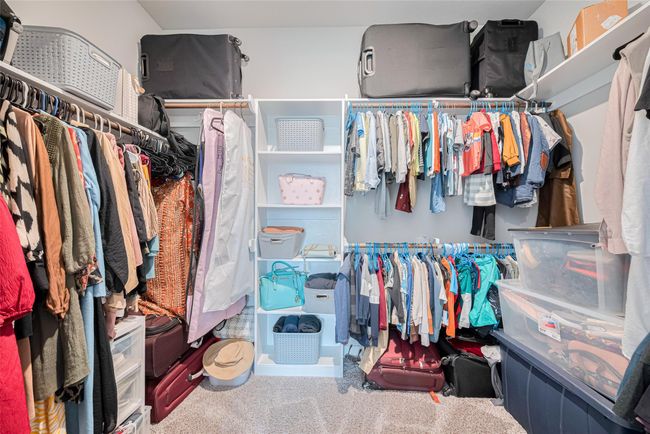 This spacious walk-in closet features ample space. | Image 31
