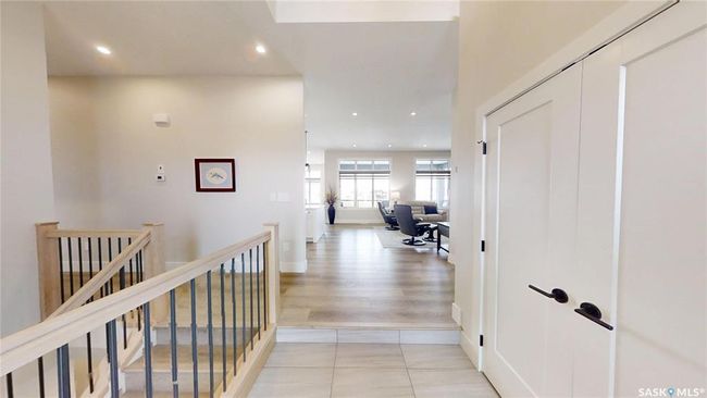 Hall with an upstairs landing, light tile patterned floors, and recessed lighting | Image 4