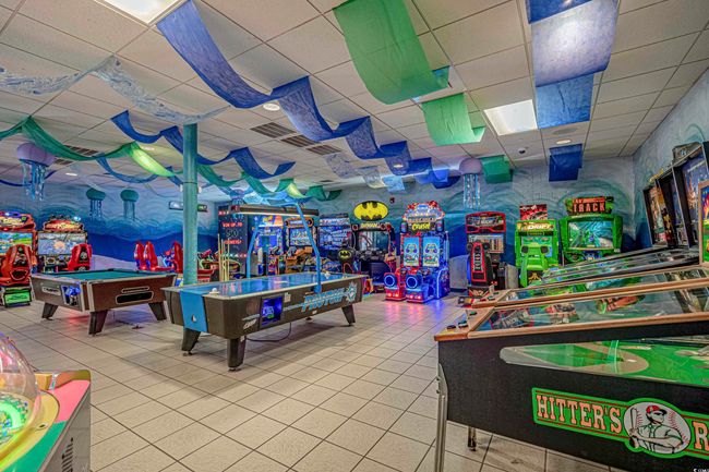 Rec room with tile patterned floors, a paneled ceiling, and pool table | Image 28