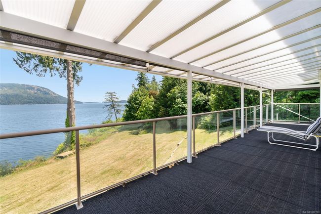 View of patio / terrace featuring a water and mountain view and a balcony | Image 82