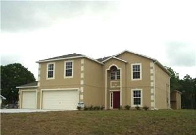 Welcome to the Mini Mansion! This 2-story home sits proudly on a spacious corner lot.... | Image 1