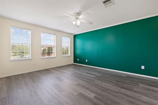 Spare room with ceiling fan, wood finished floors, Primam | Image 5