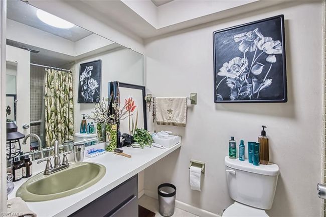 Full bath with vanity, a shower with shower curtain, and tile patterned flooring | Image 24