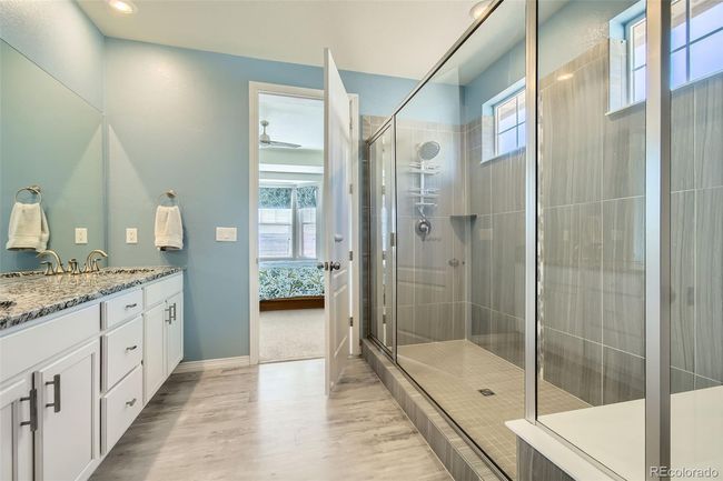Extra large shower with dual sinks and linen closet. | Image 10