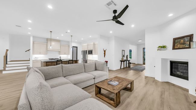 Living room featuring light wood-type flooring, recessed lighting, baseboards, and ceiling fan | Image 15