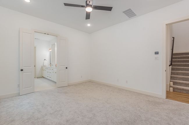 Unfurnished room featuring carpet flooring, a ceiling fan, recessed lighting, and stairway | Image 29
