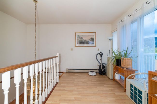 Hall featuring a baseboard radiator and light wood-type flooring | Image 20