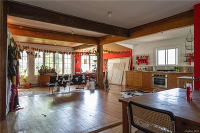 Kitchen featuring oven, light hardwood / wood-style flooring, and beamed ceiling | Image 3