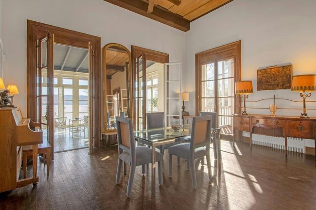 Dining room featuring wooden ceiling, french doors, dark hardwood / wood-style flooring, and beamed ceiling | Image 10
