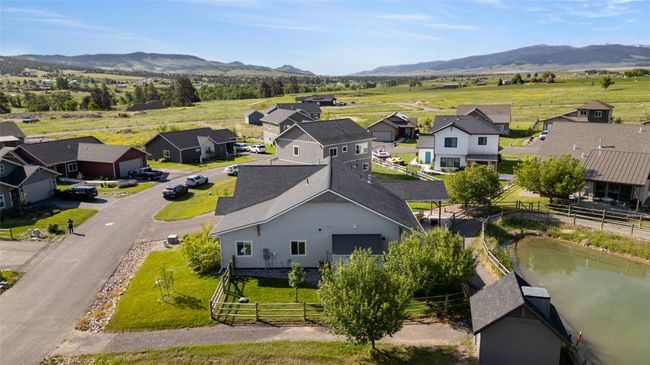 Aerial perspective of suburban area featuring a mountain backdrop | Image 40