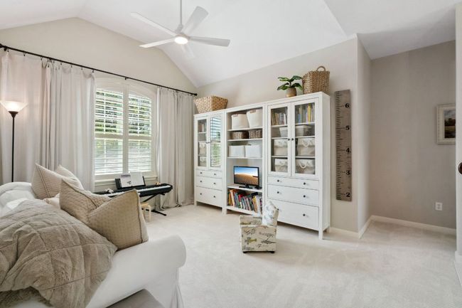 Upstairs you will find the primary suite, two secondary bedrooms, and this large bonus living area, perfect for a game room, tv room, study area, and more. | Image 20