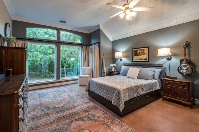 This bedroom is SO roomyj with sitting area and lovely views of nature and trees | Image 24
