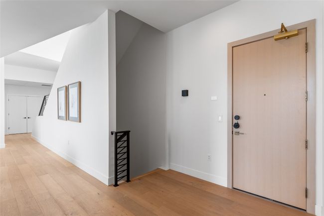 Corridor featuring light wood-type flooring and baseboards | Image 9