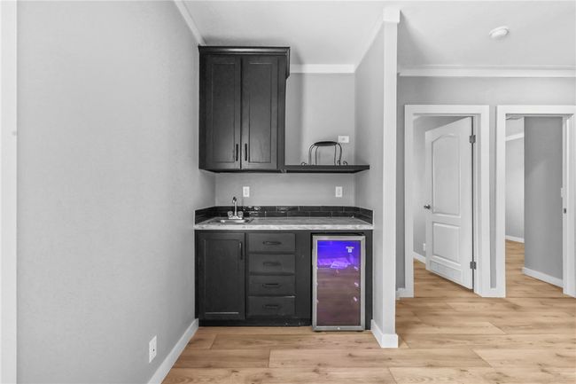 Flexible room with beverage cooler, sink, and microwave area | Image 16