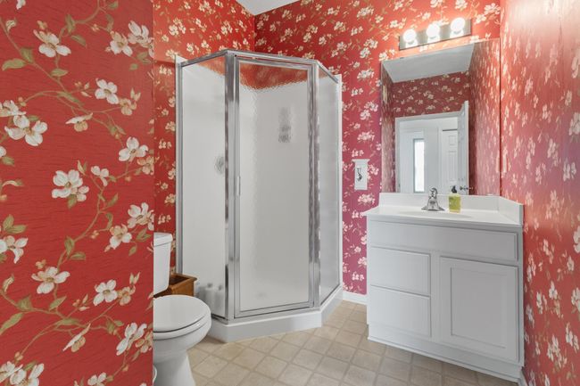 Main level 3/4 guest bathroom directly across from guest bedroom. | Image 9