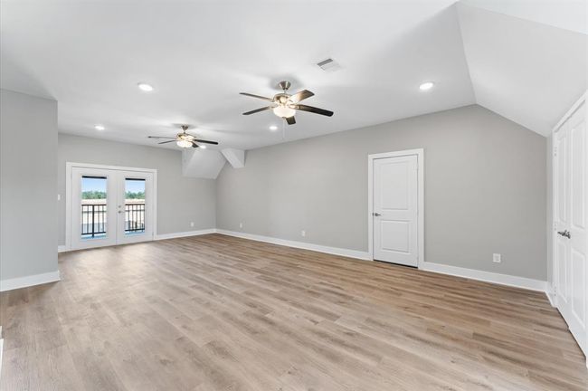 Massive game room upstairs with balcony access and room to entertain. | Image 26