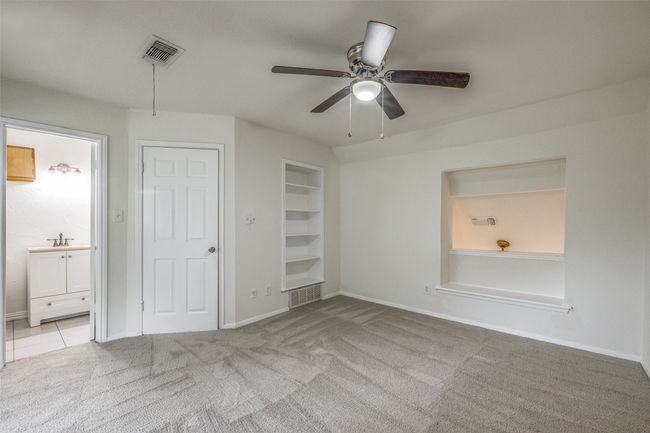 Unfurnished bedroom with carpet flooring, ensuite bathroom, and ceiling fan | Image 19