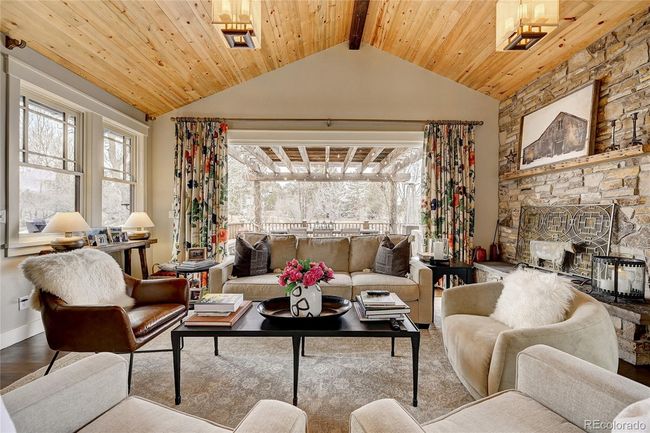 great room with accordian style door open to patio and yard | Image 10