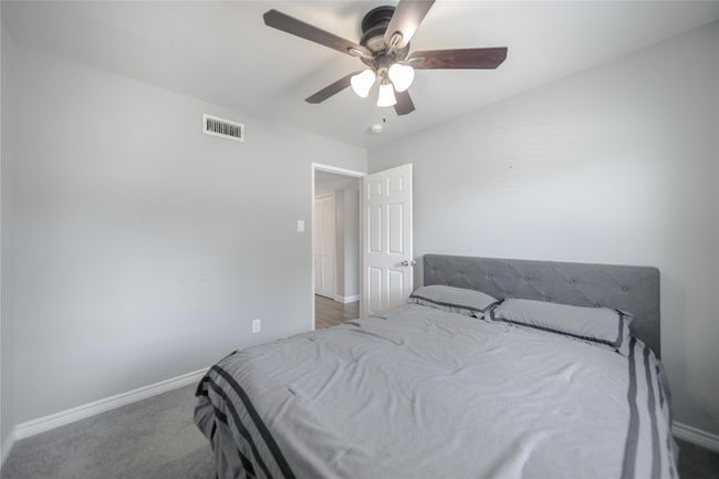 Carpeted bedroom with baseboards and ceiling fan | Image 19