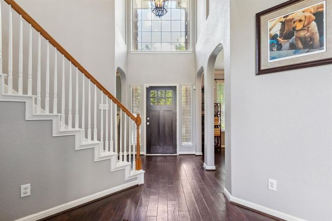 Grand 2 story entry with beautiful engineered wood floors | Image 6