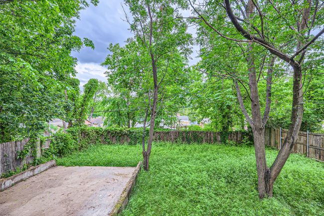 View of yard featuring a patio area and a fenced backyard | Image 26