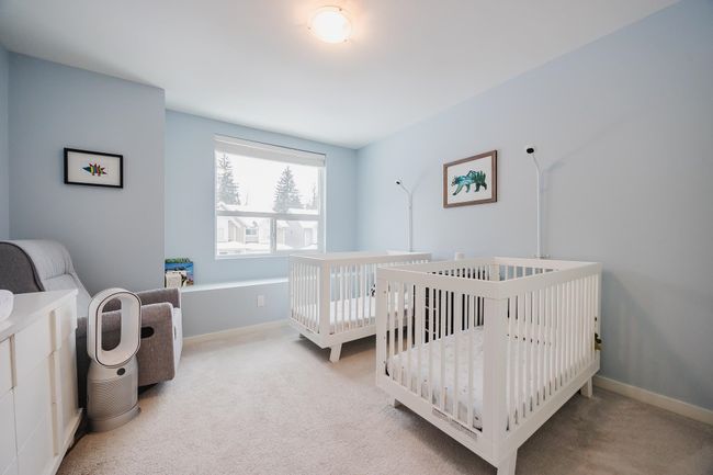 Bedroom featuring baseboards and light carpet | Image 22