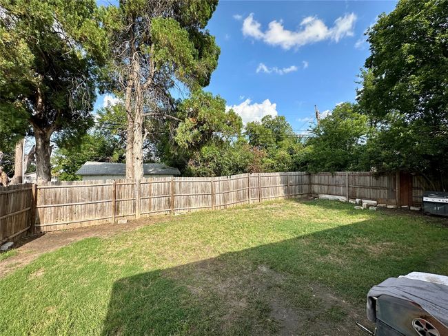 View of fenced backyard | Image 36