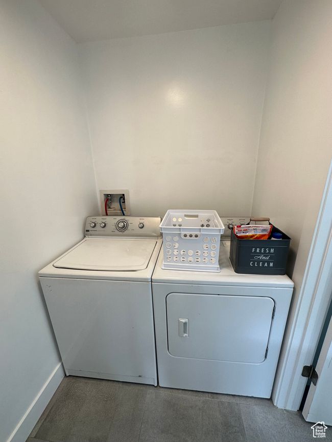 Washroom featuring washer and clothes dryer and baseboards | Image 15