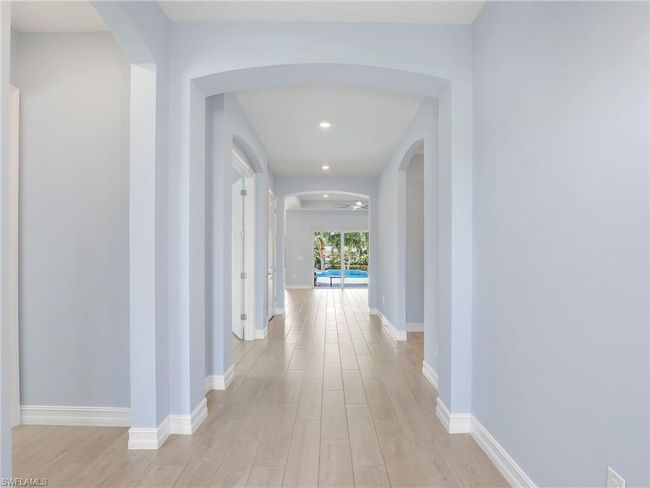 Corridor featuring light wood-type flooring | Image 9