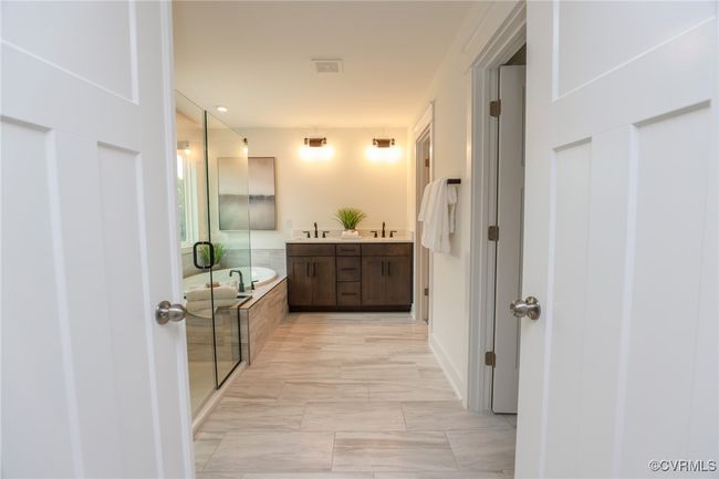 VIRTUAL STAGING. Photo represents the plan with virtual staging. Luxurious primary suite. | Image 19