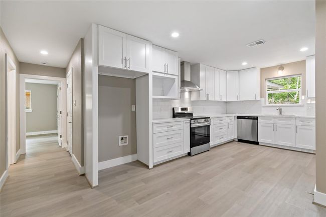 View of kitchen from living/family area. | Image 24