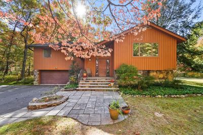 View of front of house featuring a front yard and a garage | Image 3