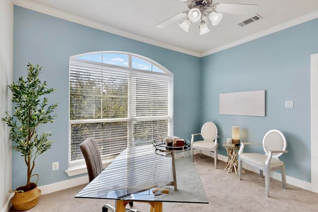Carpeted home office featuring crown molding and ceiling fan | Image 27