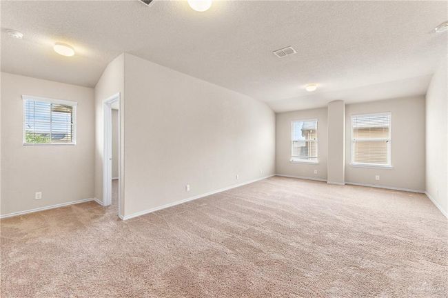 Unfurnished room featuring light carpet, a textured ceiling, and a smoke detector | Image 21
