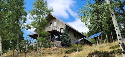 Front of house, balconies looking over unobstructed views of the mountains | Image 1