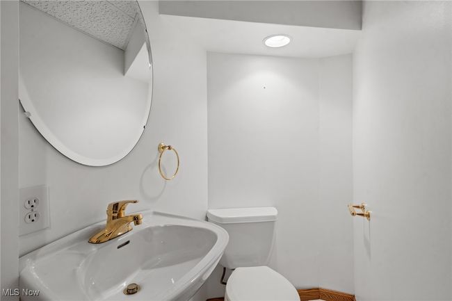 Bathroom with toilet and sink | Image 27