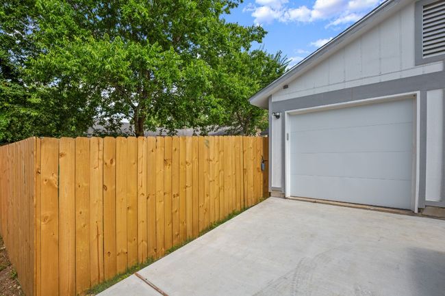 Garage with concrete driveway | Image 23