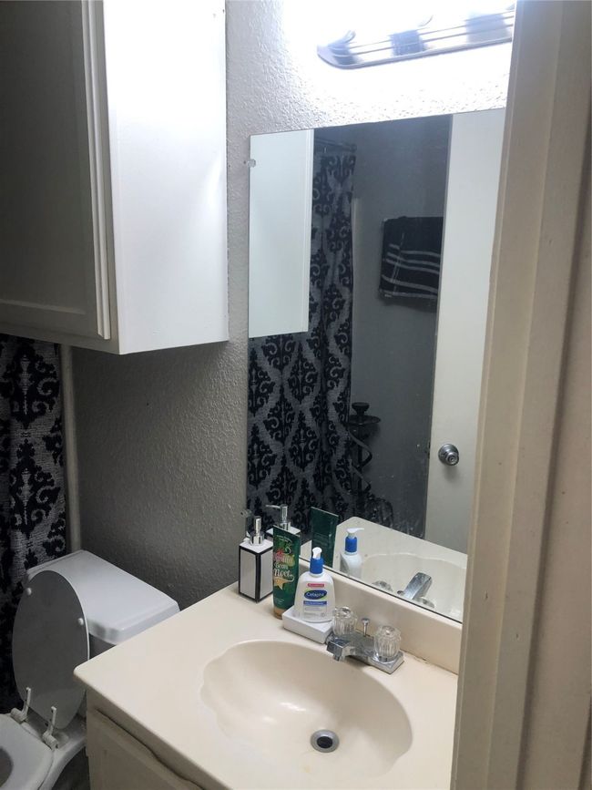 Here is another view of the bathroom. | Image 7