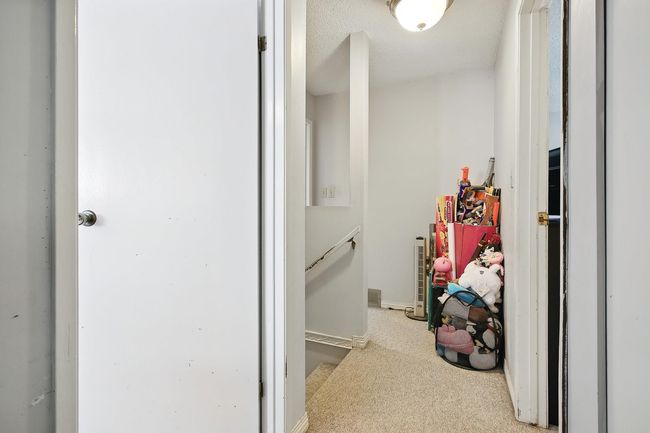 Hallway featuring carpet and baseboards | Image 22
