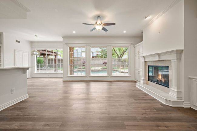 Living room with full view of the pool, lots of natural light | Image 21