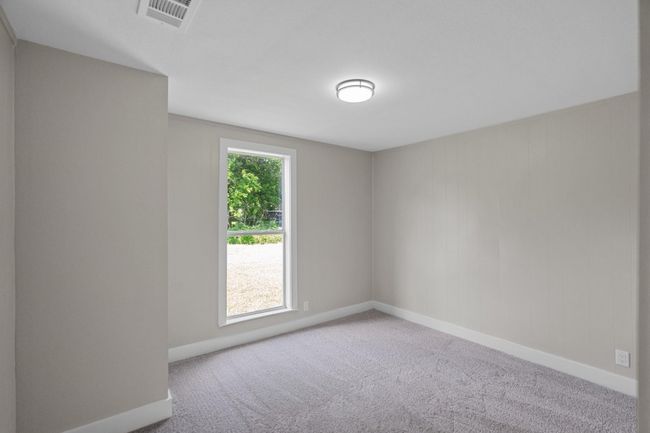 Unfurnished room with carpet flooring | Image 13