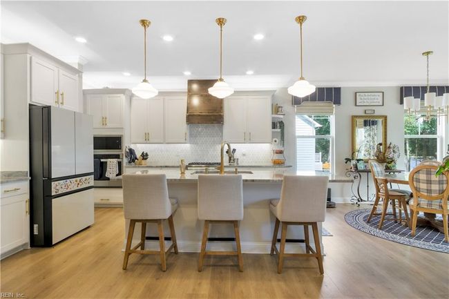Informal dining overlooks Cypress Creek | Image 12