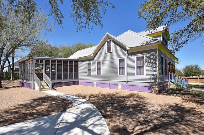 Side view of the Main house. You will notice sidewalks throughout the property. | Image 23