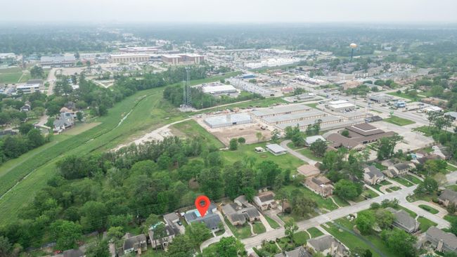 The land behind property is owned by the church that fronts Louetta. Property is not in a flood zone and has never flooded. | Image 48