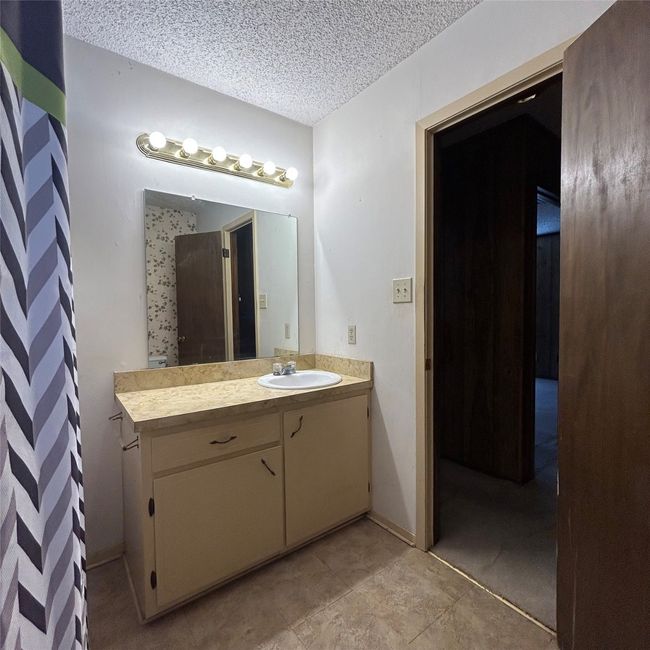 Clothes washing area featuring baseboards, wood finished floors, laundry area, and hookup for a washing machine | Image 21
